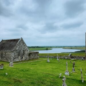 a cemetery with a stone building